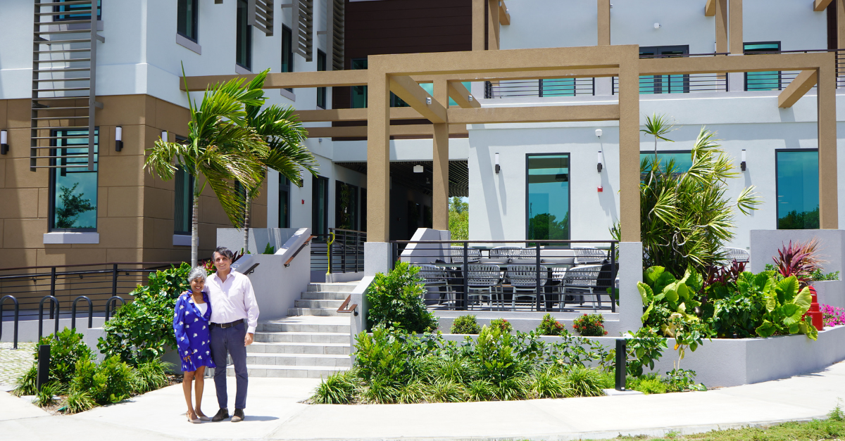 Marla Dukharan and Charlie Kirkconnell stand in front of CEC's new facilities Signal House